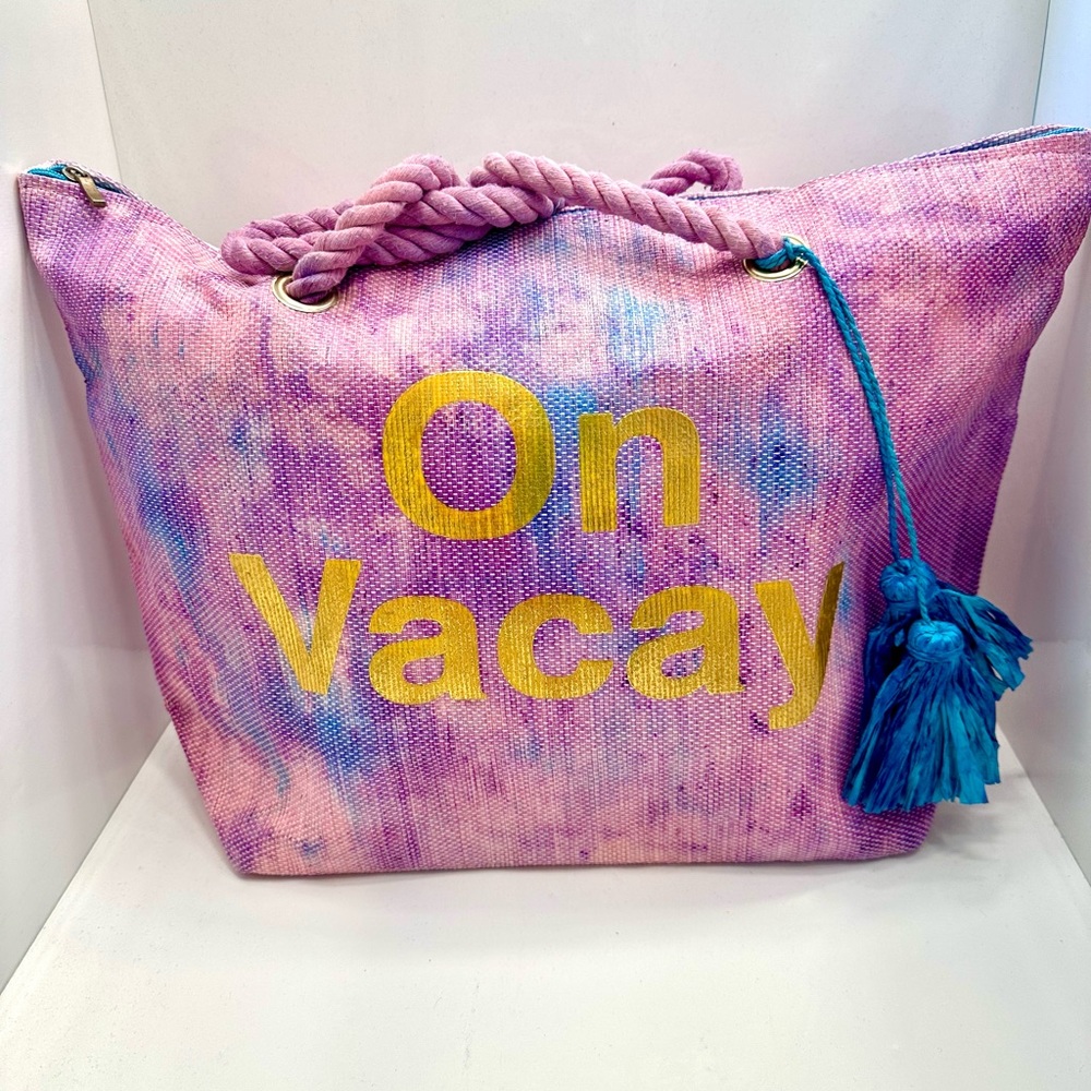 “On Vacay” Beach Bag Multi Coloured with straw tassel’s and Zipper closure.